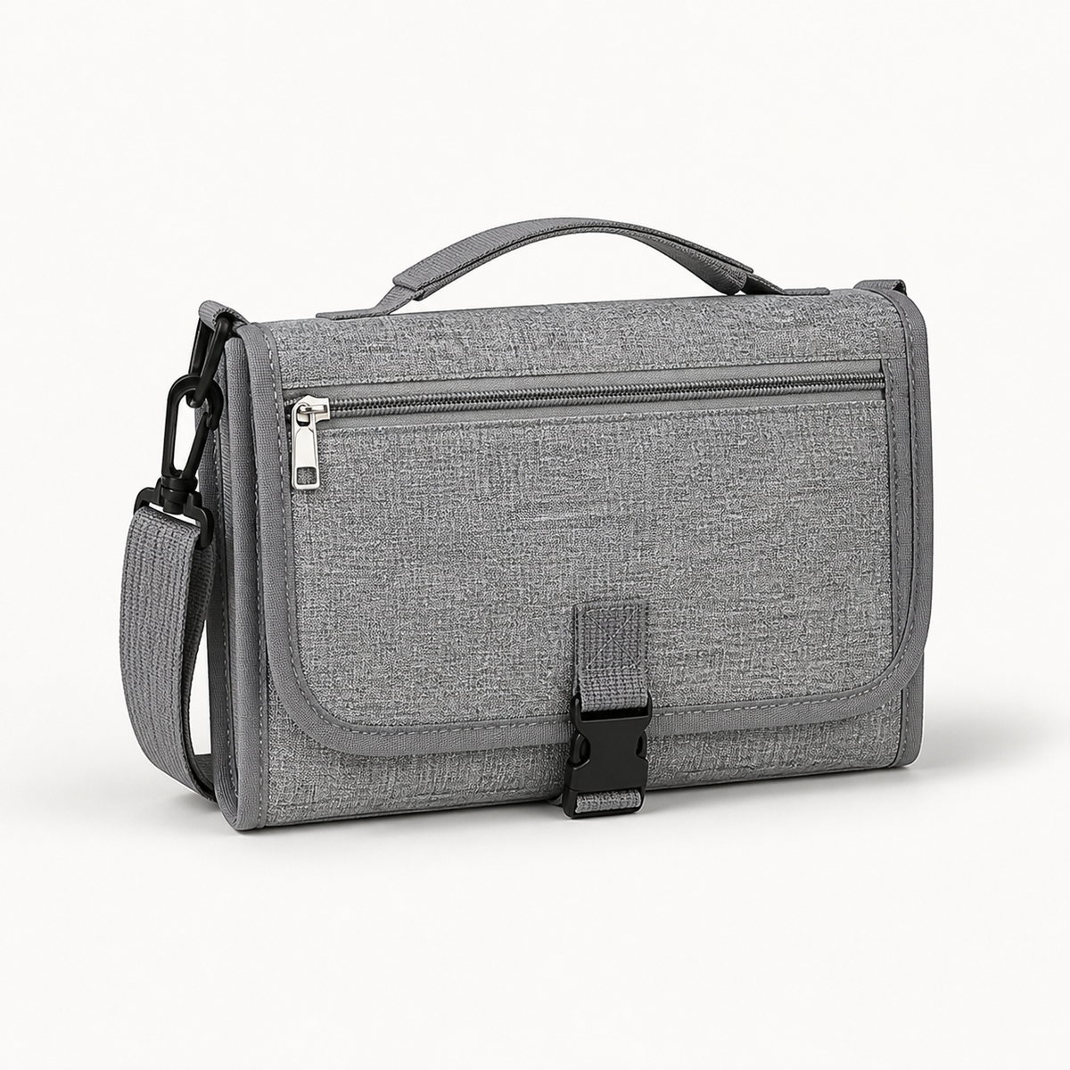 Matelas à langer nomade gris plié pour être rangé dans un sac à langer Image