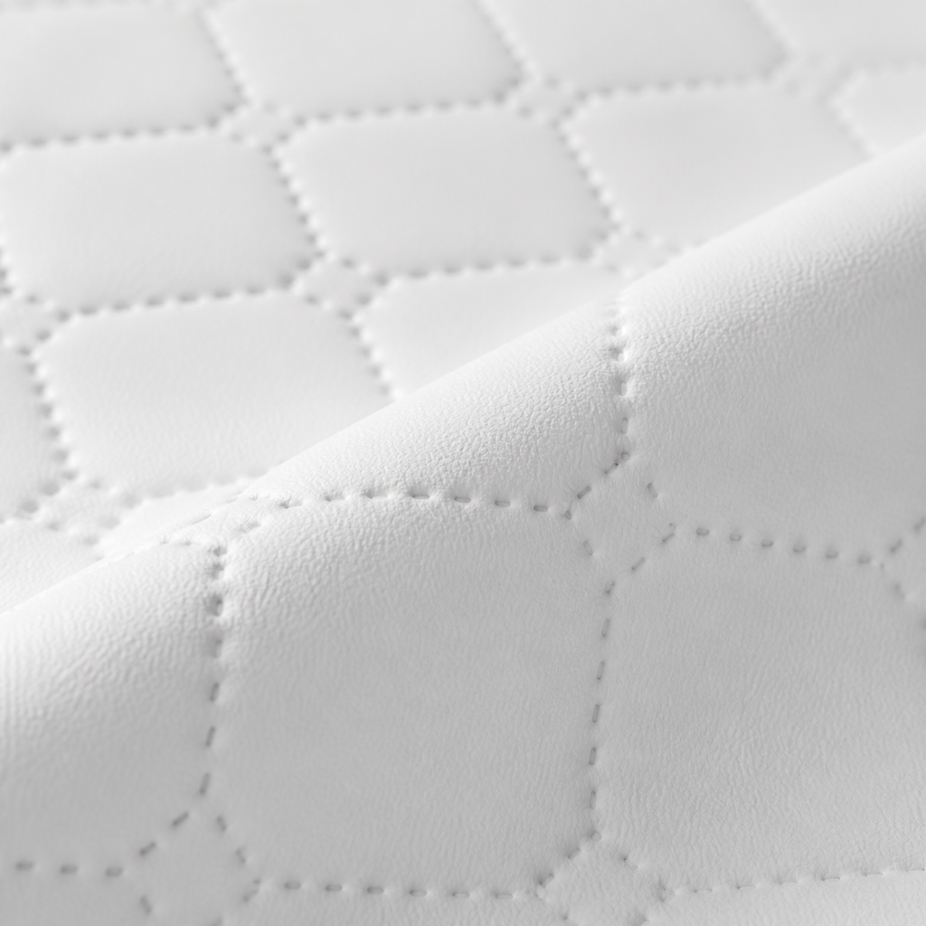 Détail des surpiqûres et du rebord du matelas à langer | NOLIERA