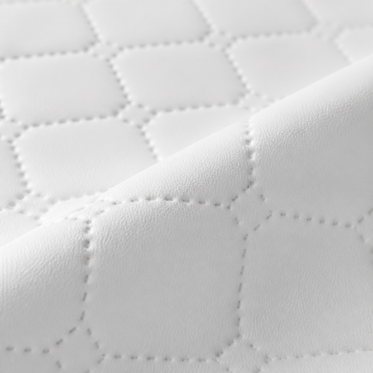 Détail des surpiqûres et du rebord du matelas à langer | NOLIERA
