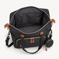 Intérieur du sac à langer bandoulière noir ouvert, rangements | NOLIERA