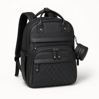 Sac à dos à langer noir effet cuir, vue studio | NOLIERA