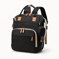 Sac à dos à langer noir en nylon matelassé, vue studio fond blanc | NOLIERA