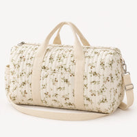 Sac de maternité matelassé imprimé de fleurs vertes, vue de trois quarts